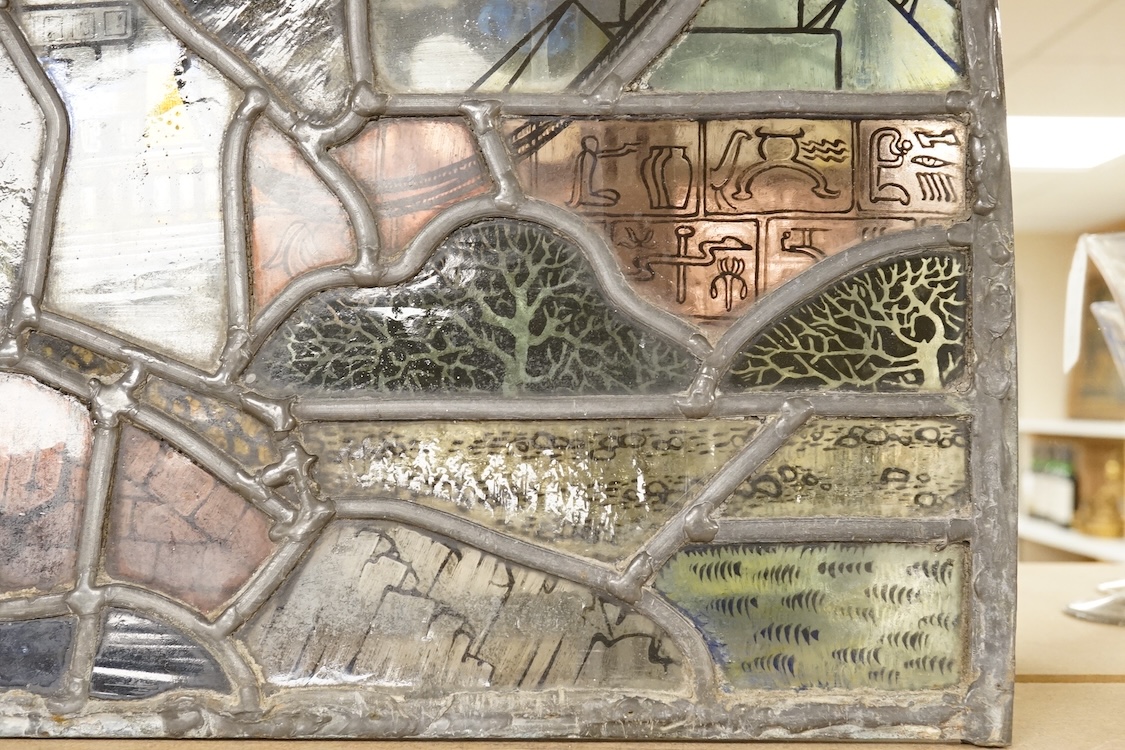 A 20th century semi circular stained glass panel, approximately 80cm wide